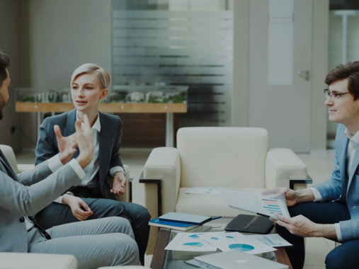 Three business people in a meeting