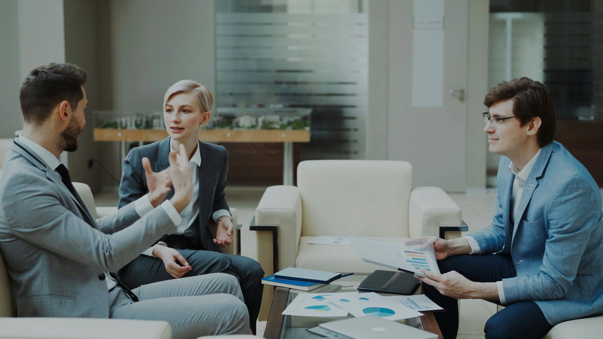 three-business-people-in-a-meeting.jpg Three business people in a meeting